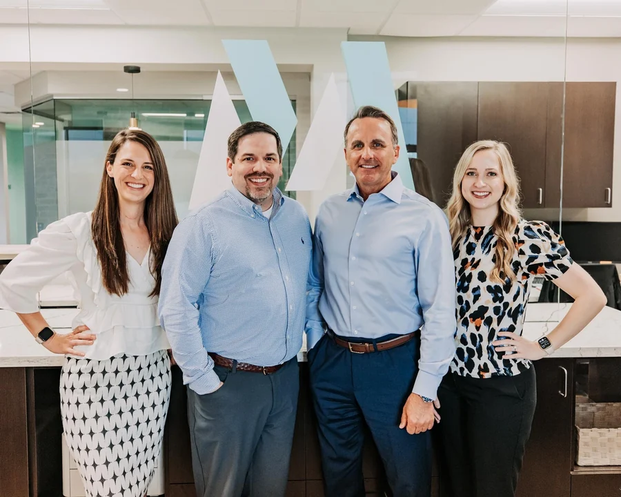 Dr. Nathalie Dunwody, Dr. Michael Maher, Dr. David Montz and Dr. Macie Long standing together at the front desk.